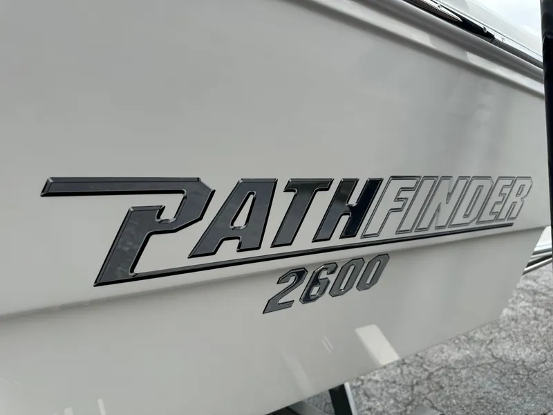 Slide: The Image of 2024 Pathfinder 2600 HPS boat logo on white hull. - 14