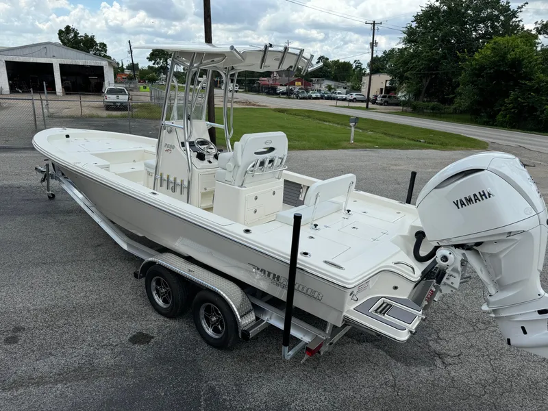 Slide: The Image of 2024 Pathfinder 2600 HPS boat on trailer with Yamaha engine, parked outdoors. - 3