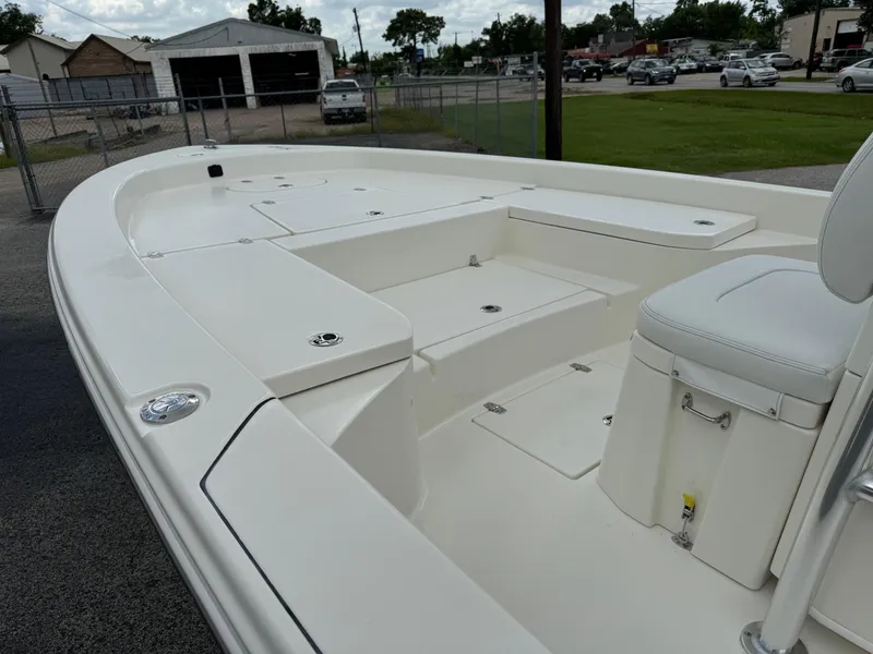 Slide: The Image of 2024 Pathfinder 2600 HPS boat deck, featuring spacious seating and storage compartments. - 9