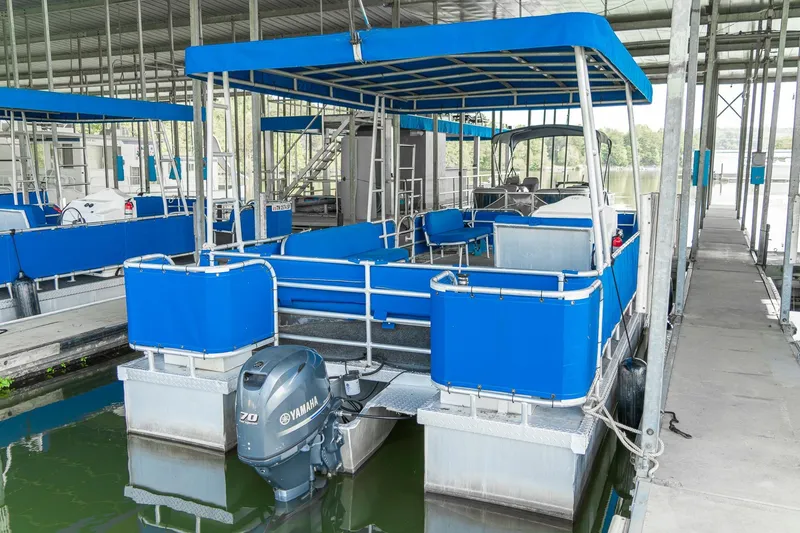 Slide: The Image of Pontoon boat with blue canopy and Yamaha motor in marina, 2000 Custom model. - 11