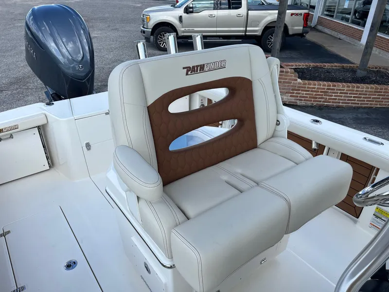 Slide: The Image of 2025 Pathfinder 2400 Open boat seat with brown and white upholstery. - 11