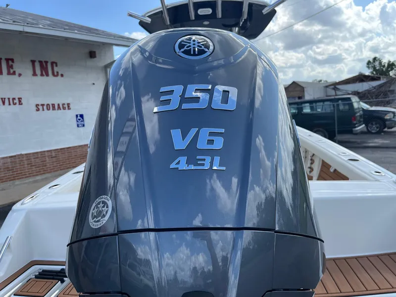 Slide: The Image of 2025 Pathfinder 2400 Open boat with Yamaha 350 V6 4.3L engine, outdoor setting. - 14