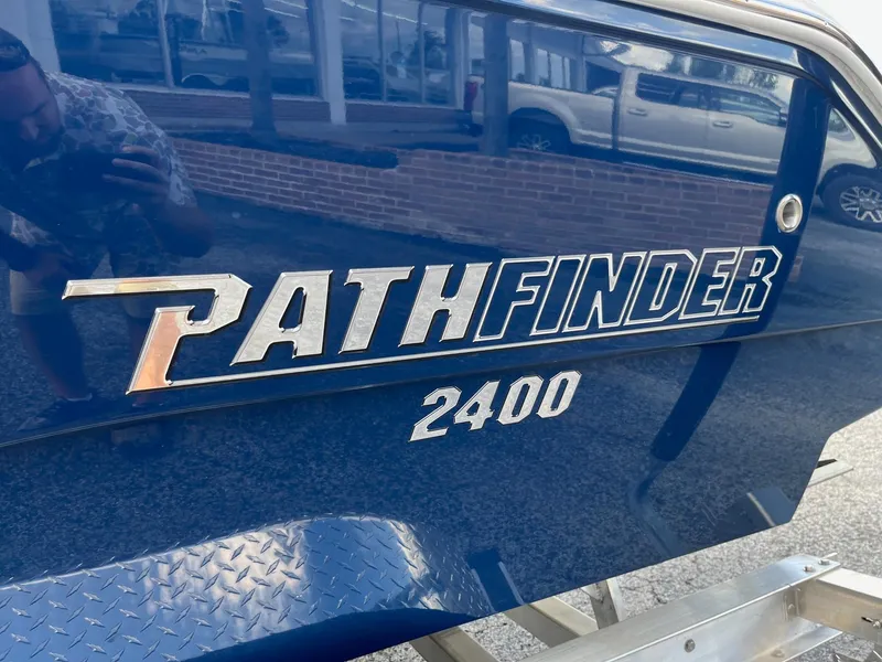 Slide: The Image of 2025 Pathfinder 2400 Open boat logo on a blue hull. - 16