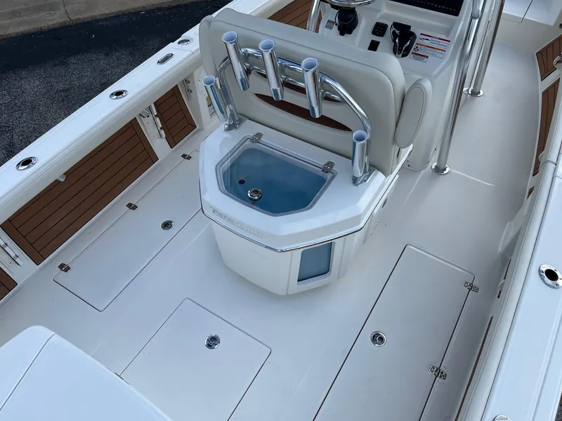 Slide: The Image of 2025 Pathfinder 2400 Open boat interior with rod holders and storage compartments. - 5
