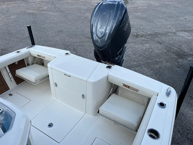 Slide: The Image of 2025 Pathfinder 2400 Open boat with Yamaha outboard motor, featuring white seating and storage. - 7