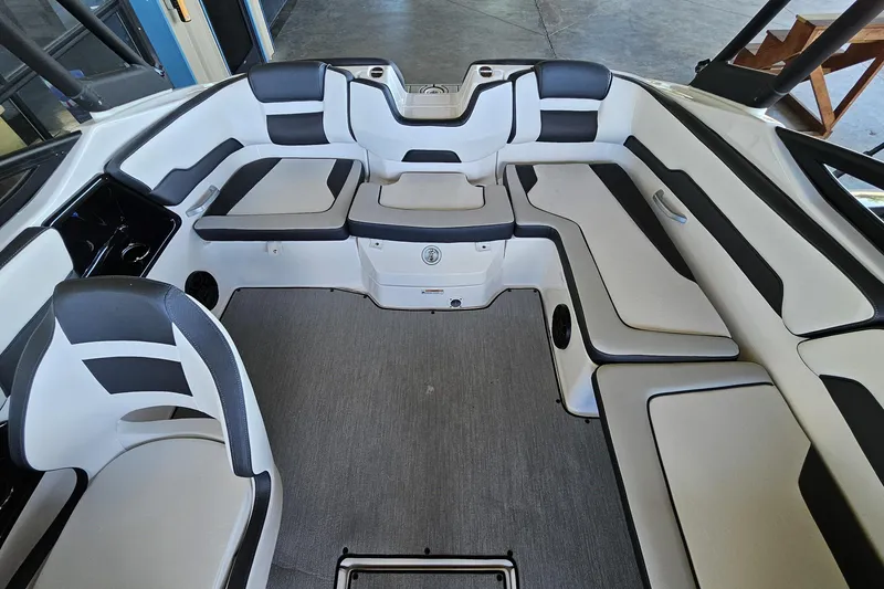Slide: The Image of 2025 Yamaha Boats AR195 interior with spacious seating and modern design. - 12