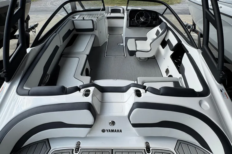 Slide: The Image of 2025 Yamaha Boats AR195 interior with sleek seating and modern dashboard design. - 16