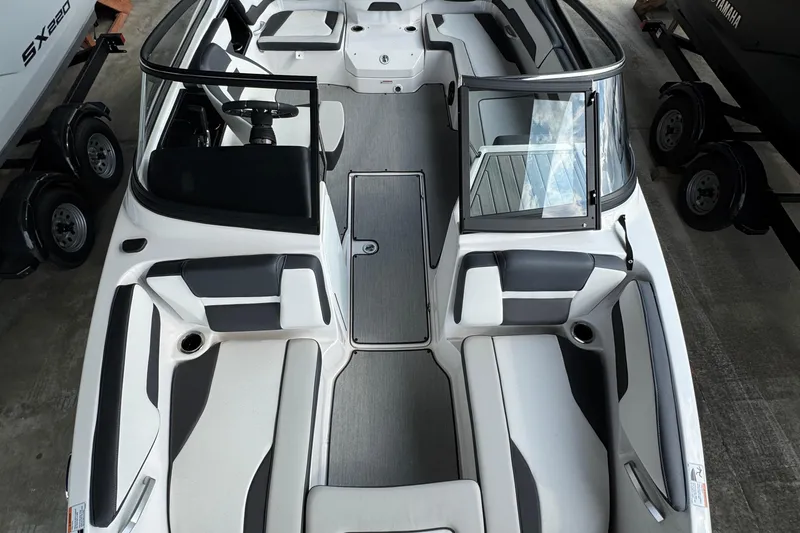 Slide: The Image of 2025 Yamaha Boats AR195 interior with sleek seating and modern design. - 17