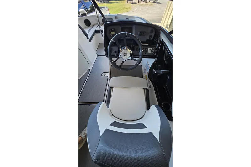 Slide: The Image of 2025 Yamaha Boats AR195 cockpit with steering wheel and seating. - 2