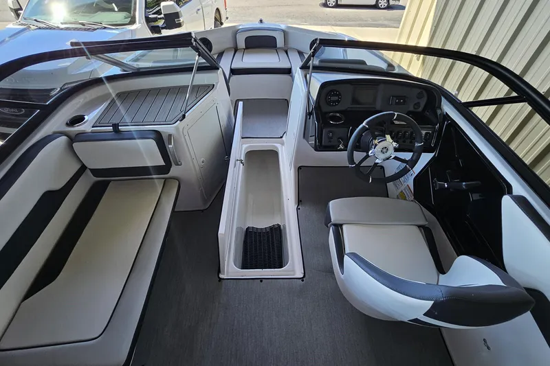 Slide: The Image of 2025 Yamaha Boats AR195 interior with sleek seating and modern dashboard design. - 9
