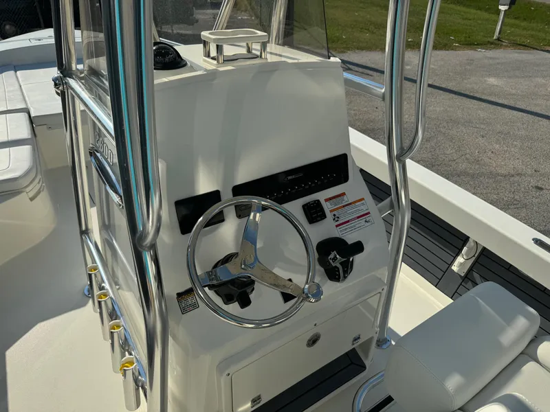 Slide: The Image of 2025 Pathfinder 2600 TRS boat console with steering wheel and controls. - 15