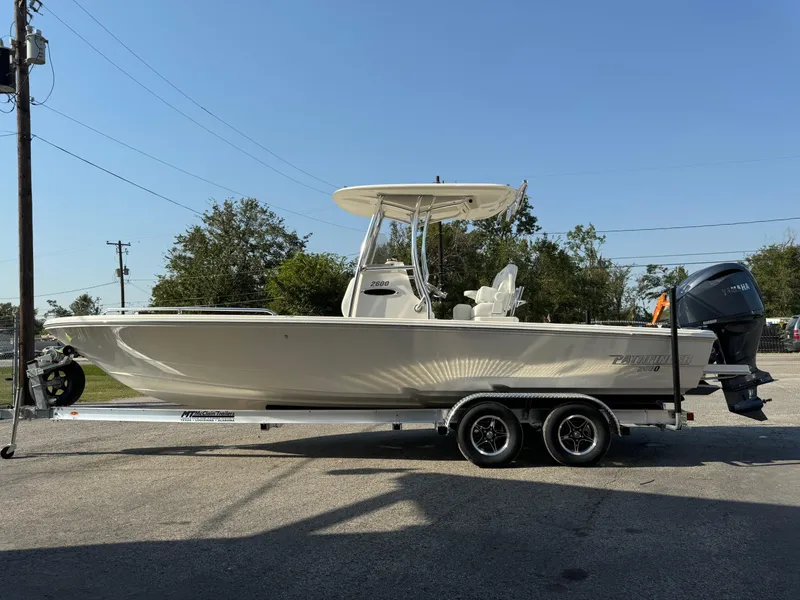 Slide: The Image of 2025 Pathfinder 2600 TRS boat on trailer, side view, outdoors. - 4
