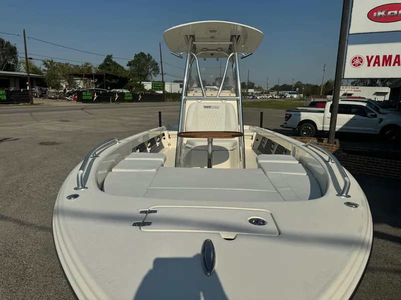 Slide: The Image of 2025 Pathfinder 2600 TRS boat, front view, parked outdoors near Yamaha sign. - 5