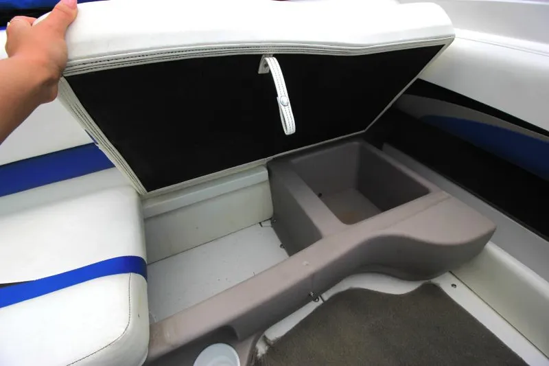 Slide: The Image of 2003 Glastron SX 175 boat interior with storage compartment under seat. - 20