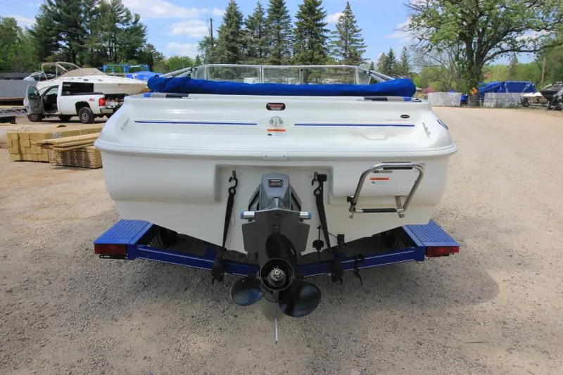 Slide: The Image of 2003 Glastron SX 175 boat rear view with propeller, parked on a trailer. - 4