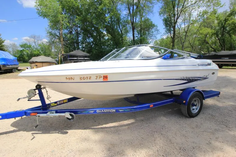 Slide: The Image of 2003 Glastron SX 175 boat on trailer, parked outdoors. - 8