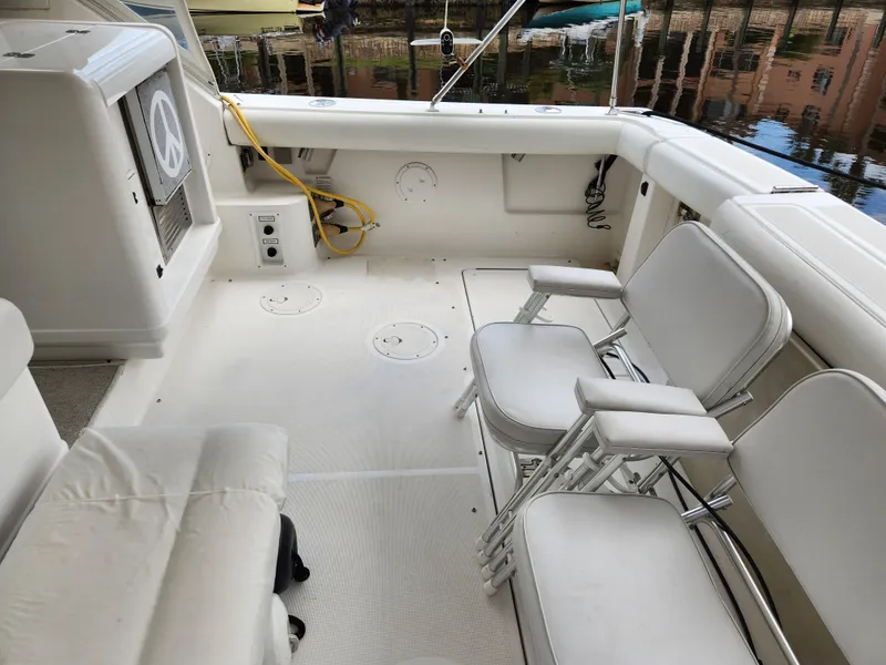 Slide: The Image of 2001 Tiara Yachts 3100 Open cockpit with white seating and clean deck. - 13
