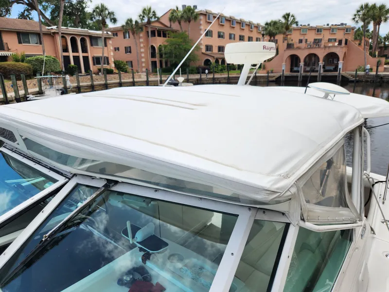 Slide: The Image of 2001 Tiara Yachts 3100 Open docked near waterfront buildings. - 37