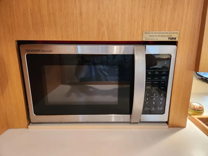 Slide: The Image of Built-in Sharp Carousel microwave in 2001 Tiara Yachts 3100 Open kitchen area. - 42