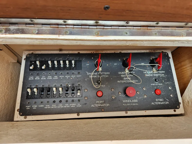 Slide: The Image of Control panel of a 2001 Tiara Yachts 3100 Open, featuring switches and indicators. - 52
