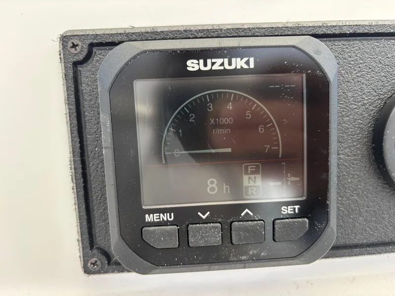 Slide: The Image of Digital Suzuki gauge display on Blazer Bay 2020 boat, showing 8 hours runtime. - 11