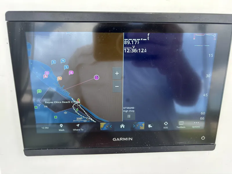 Slide: The Image of Garmin navigation display on a Blazer Bay 2020 boat, showing a nautical map and coordinates. - 12