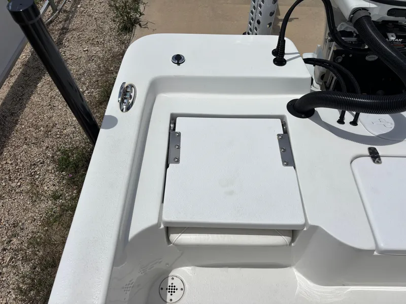 Slide: The Image of Blazer Bay 2020 boat deck, 2023 model, featuring a white hatch and engine components. - 14