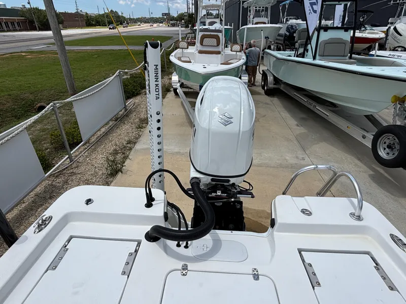 Slide: The Image of Blazer Bay 2020 boat with outboard motor, parked in a marina, 2023 model. - 16