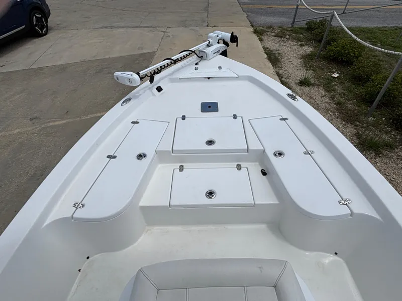 Slide: The Image of 2023 Blazer Bay 2020 boat deck with storage compartments and trolling motor. - 17