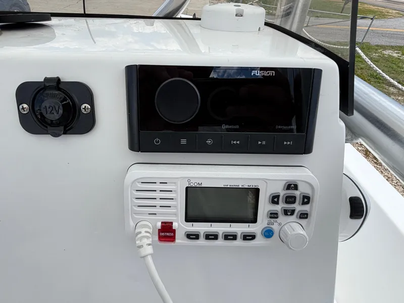 Slide: The Image of Control panel of a 2023 Blazer Bay 2020 boat with radio and 12V socket. - 20