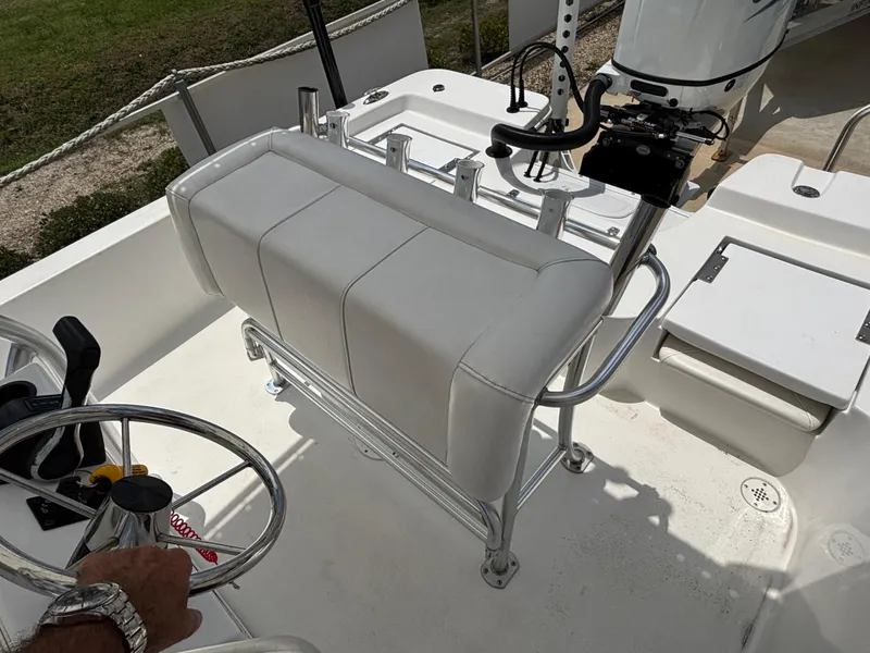 Slide: The Image of Interior of a 2023 Blazer Bay 2020 boat with white seating and steering wheel. - 22