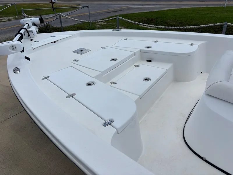 Slide: The Image of 2023 Blazer Bay 2020 boat deck with storage compartments and trolling motor. - 24