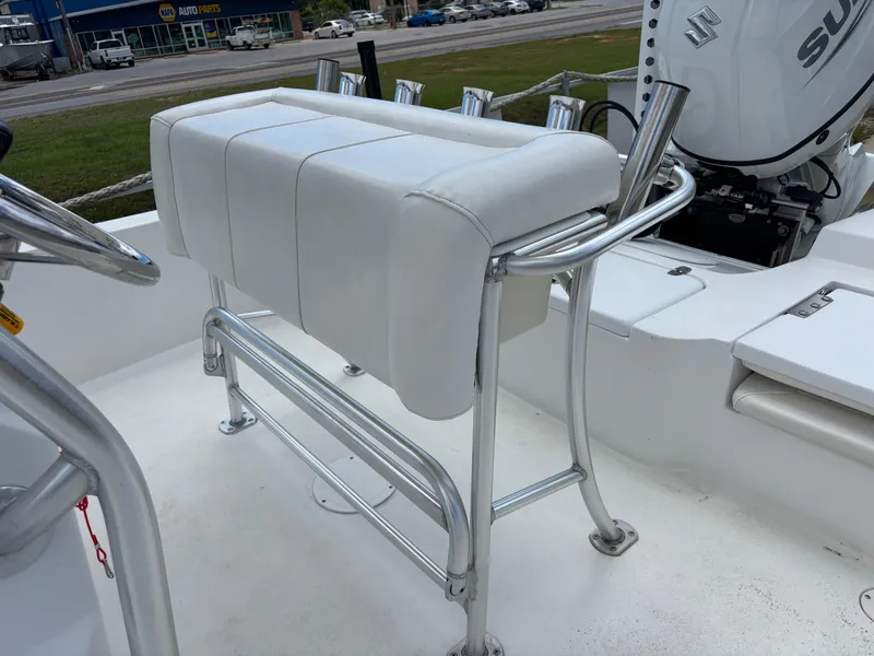 Slide: The Image of White cushioned seat on Blazer Bay 2020 boat, featuring stainless steel frame and rod holders. - 27