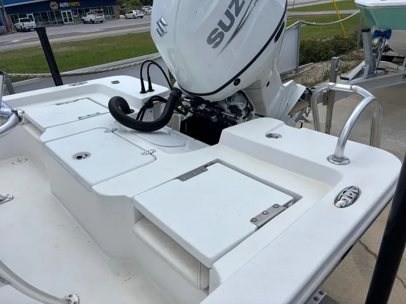 Slide: The Image of Blazer Bay 2020 boat with Suzuki engine, 2023 model, parked outdoors. - 28