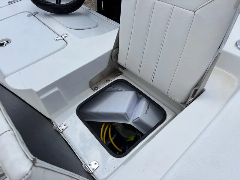 Slide: The Image of Blazer Bay 2020 boat seat storage compartment with visible equipment, 2023 model. - 30