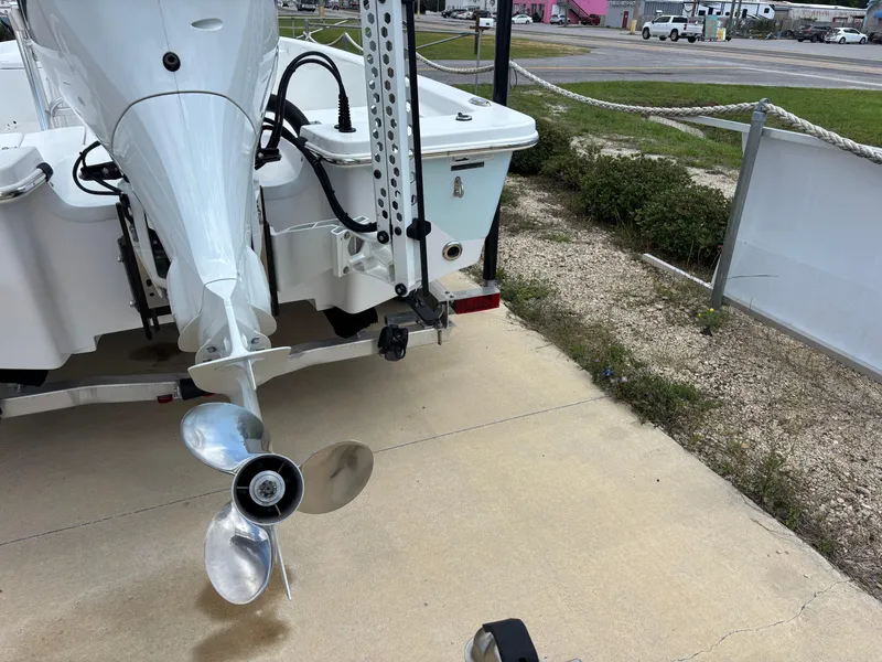 Slide: The Image of Rear view of a 2023 Blazer Bay 2020 boat with an outboard motor. - 35
