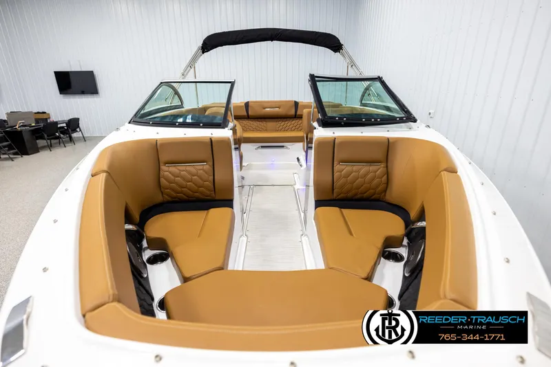 Slide: The Image of 2023 Four Winns H2 boat interior with tan seating and modern design. - 18