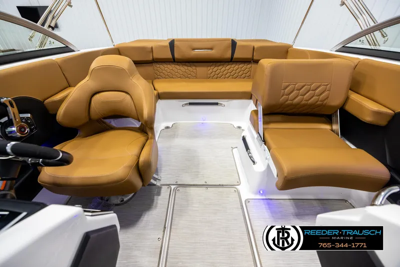 Slide: The Image of 2023 Four Winns H2 boat interior with tan leather seating and modern design. - 19