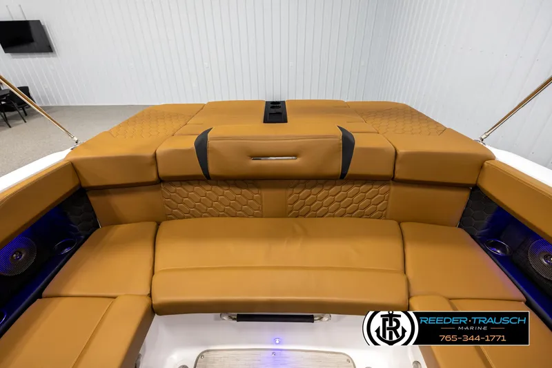 Slide: The Image of 2023 Four Winns H2 boat interior with tan leather seating and modern design. - 22