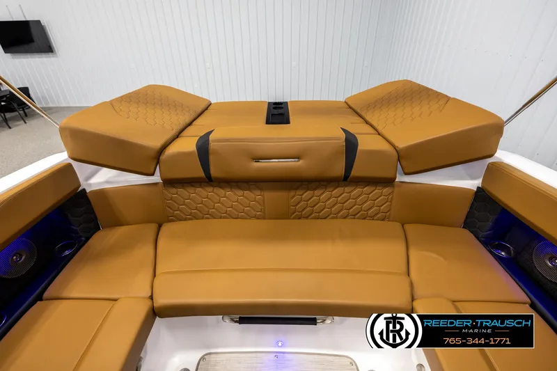 Slide: The Image of 2023 Four Winns H2 boat interior with tan leather seating and modern design. - 24