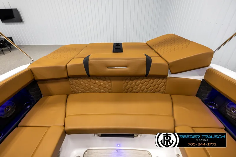Slide: The Image of 2023 Four Winns H2 boat interior with tan leather seating and modern design. - 25