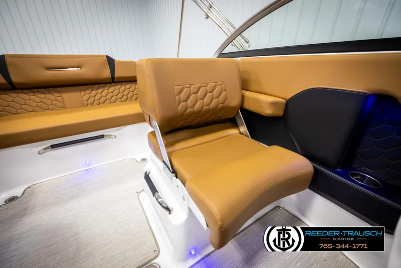 Slide: The Image of 2023 Four Winns H2 boat interior with tan leather seating and modern design. - 29