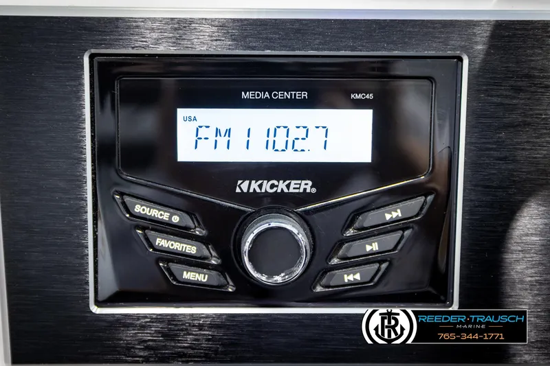 Slide: The Image of Kicker media center display in 2023 Four Winns H2 boat, tuned to FM 102.7. - 34