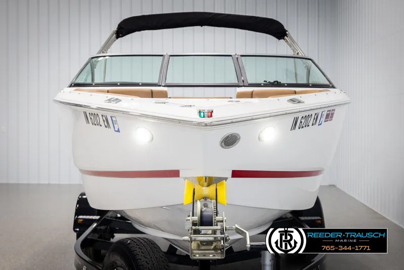 Slide: The Image of 2023 Four Winns H2 boat on trailer in indoor showroom. - 8