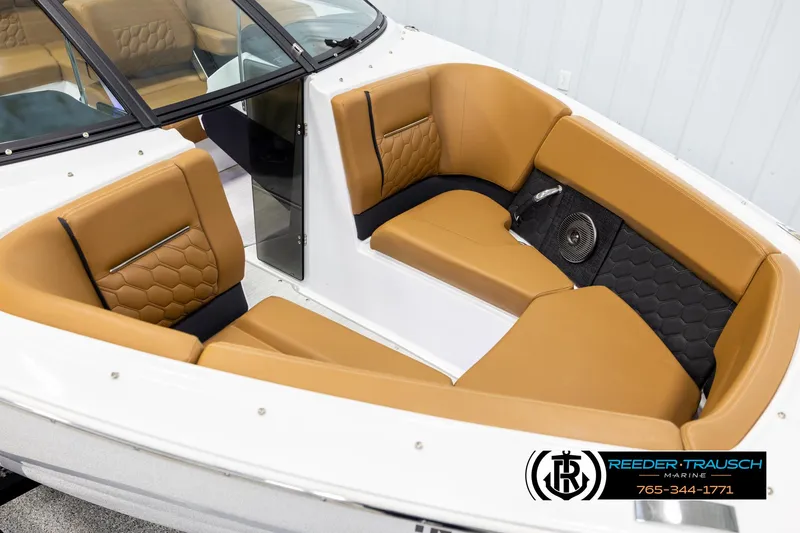 Slide: The Image of 2023 Four Winns H2 boat interior with tan seating and black accents. - 9