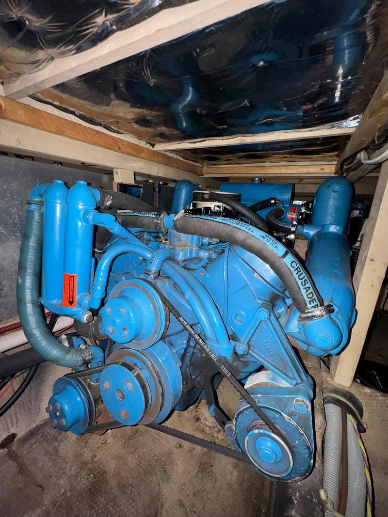 Slide: The Image of 1987 Mainship 40 Aft Cabin engine, blue, detailed view in boat's engine room. - 43