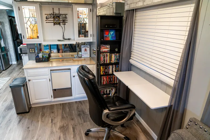 Slide: The Image of Office space in a 1991 Sumerset 65 x 14 Widebody Houseboat with desk and chair. - 10