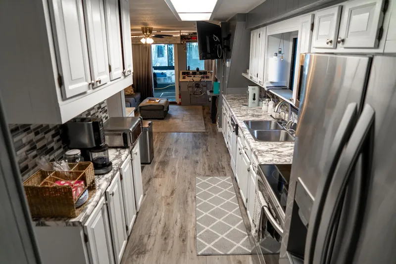 Slide: The Image of Modern kitchen interior in a 1991 Sumerset 65 x 14 Widebody Houseboat. - 19
