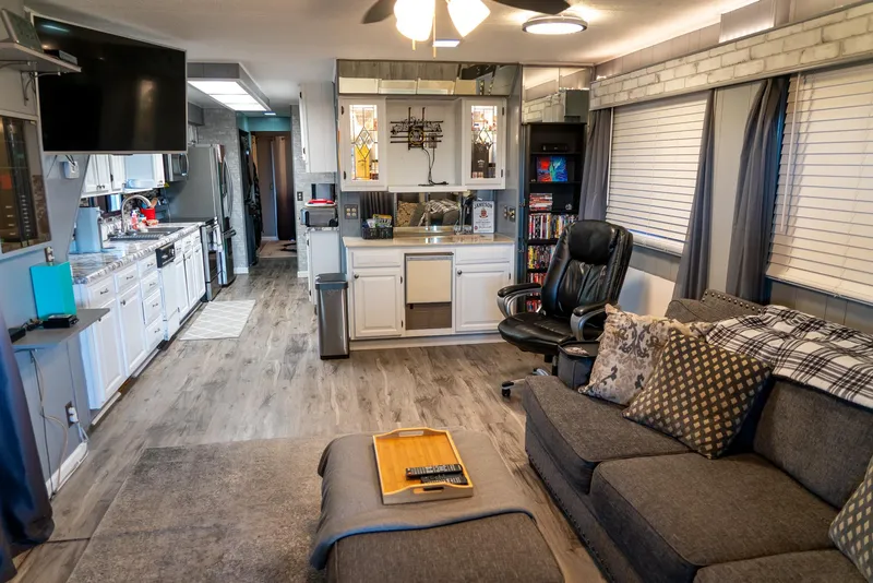 Slide: The Image of Interior of a 1991 Sumerset 65 x 14 Widebody Houseboat, featuring modern living space. - 2