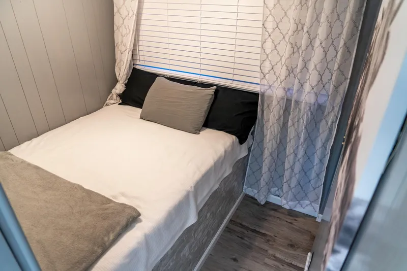 Slide: The Image of Cozy bedroom in 1991 Sumerset 65 x 14 Widebody Houseboat with modern decor. - 21